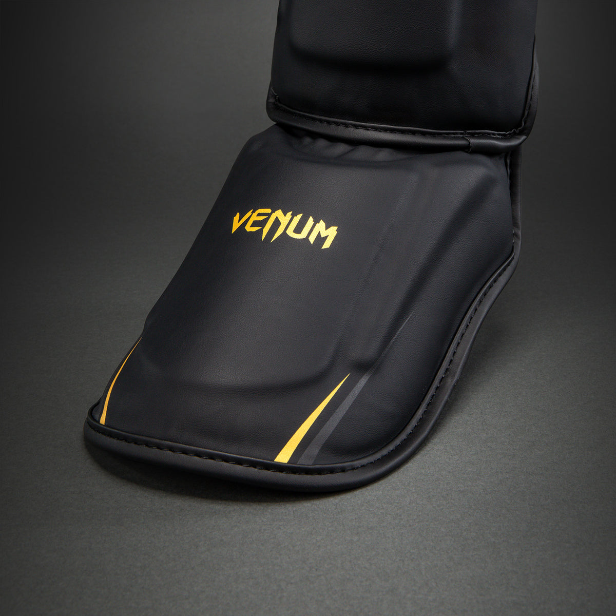 Venum G-Core Paratibie - Nero/Oro