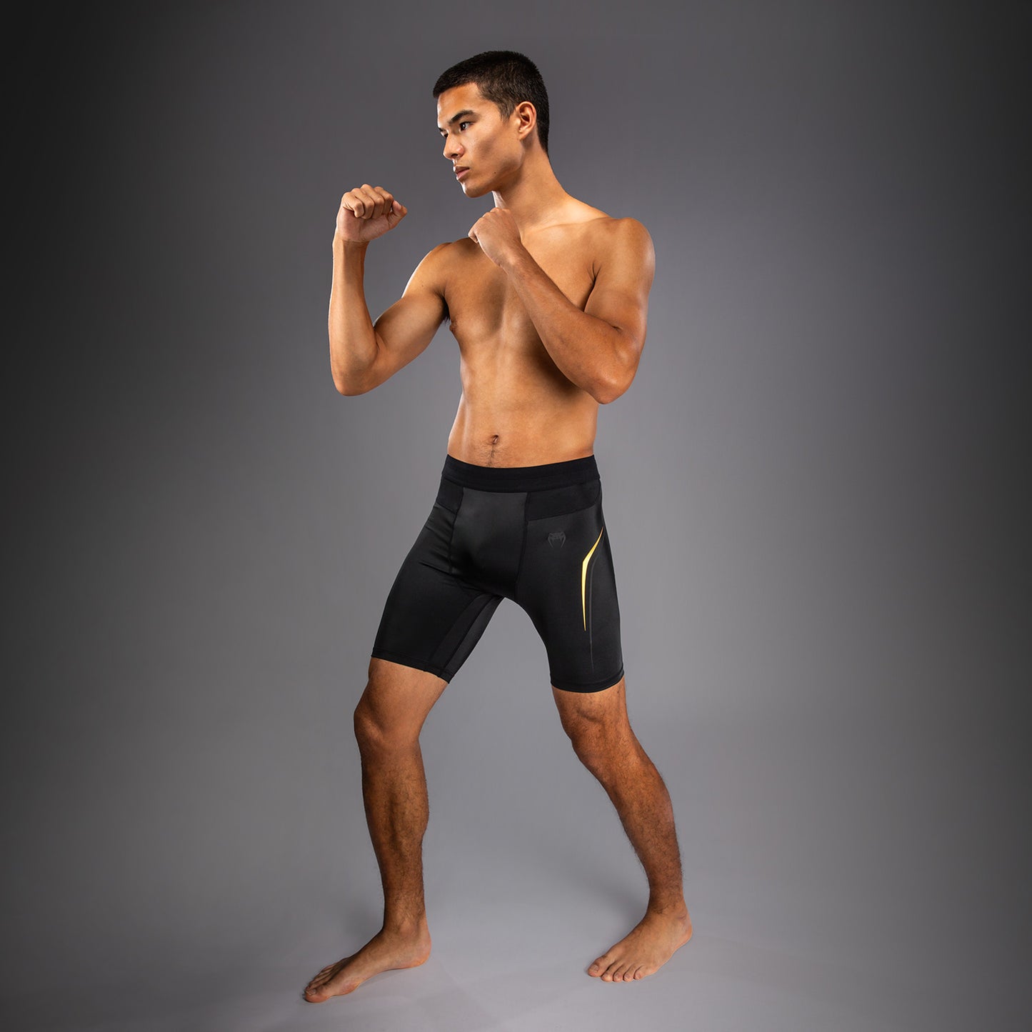 Venum G-Core Pantaloncini a Compressione - Nero/Oro