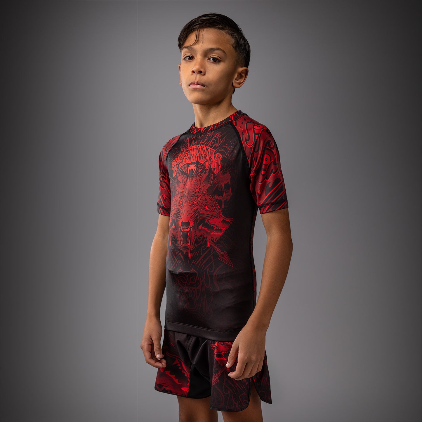 Venum Wolf Atak Rashguard a Maniche Corte Per Bambini – Nero/Rosso